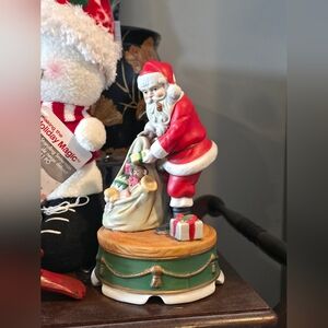 Vintage Santa Claus Figurine with Red Suit and Green Base